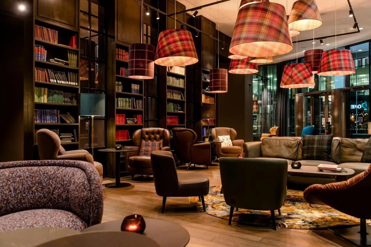 Library-style lounge with bookshelves at the Manchester hotel